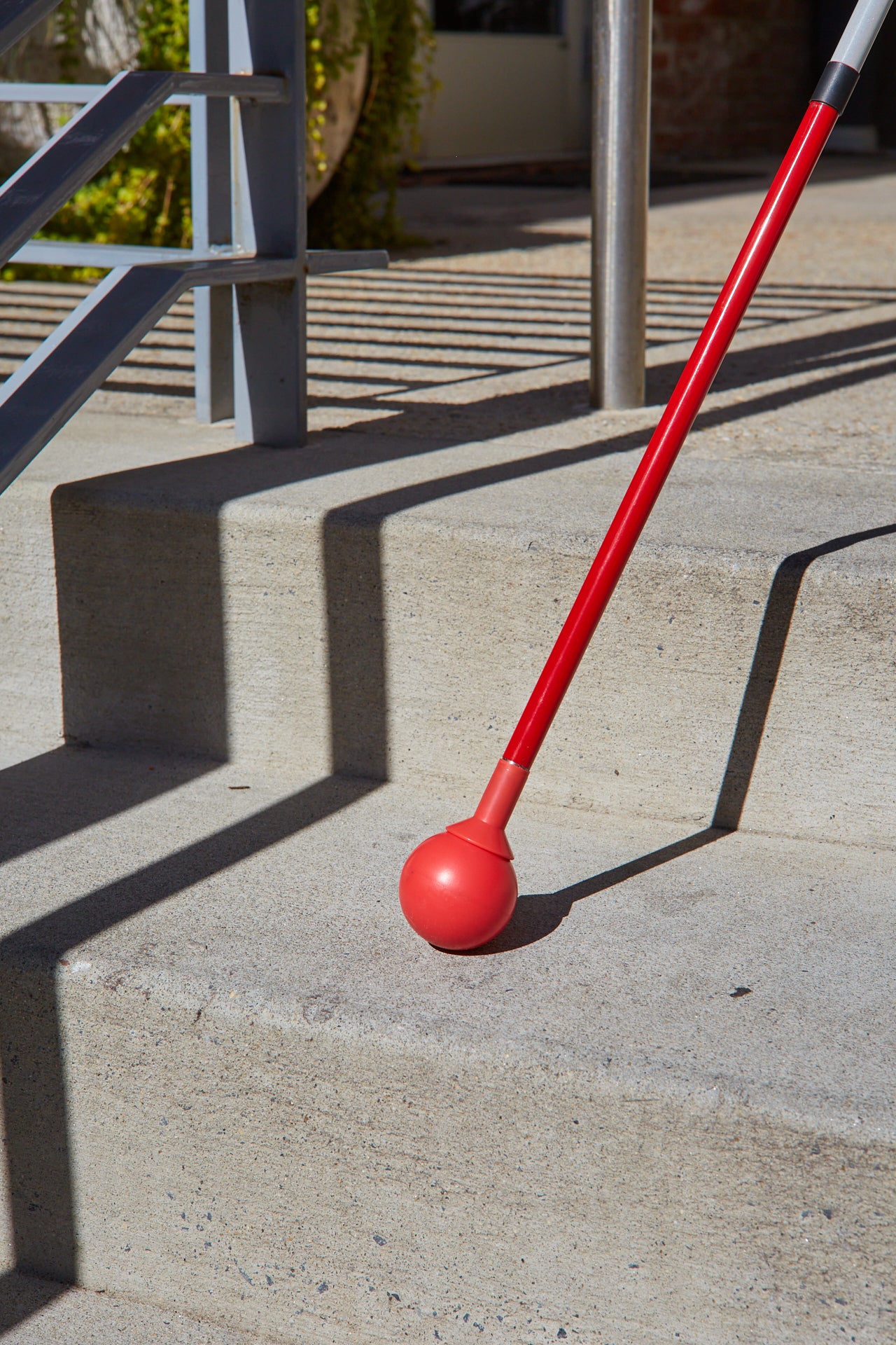 Image of the Awarewolf Gear All Terrain Cane in an urban environment.