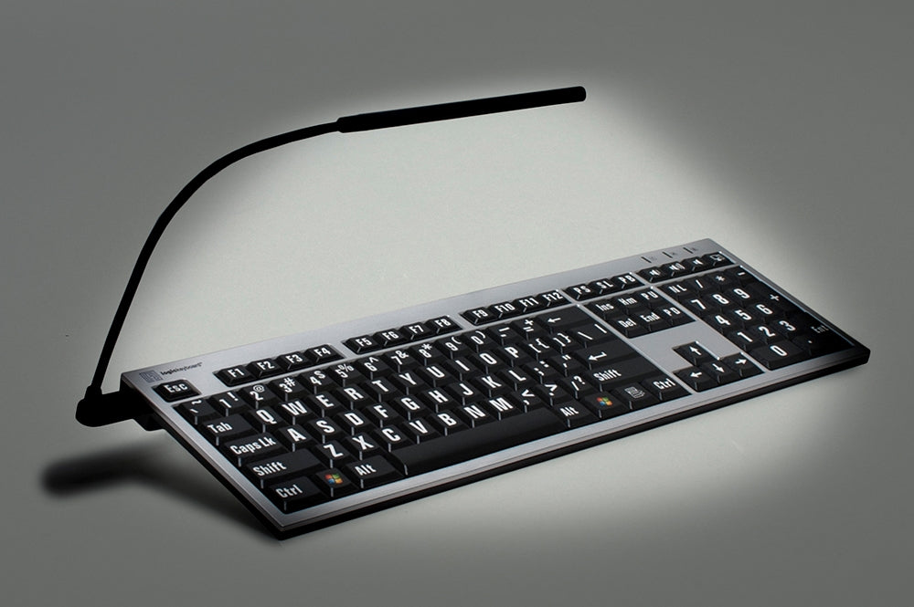 Image showing of the LogicKeyboard ALBA LargePrint White on Black Keyboard for Mac with included clip on light.