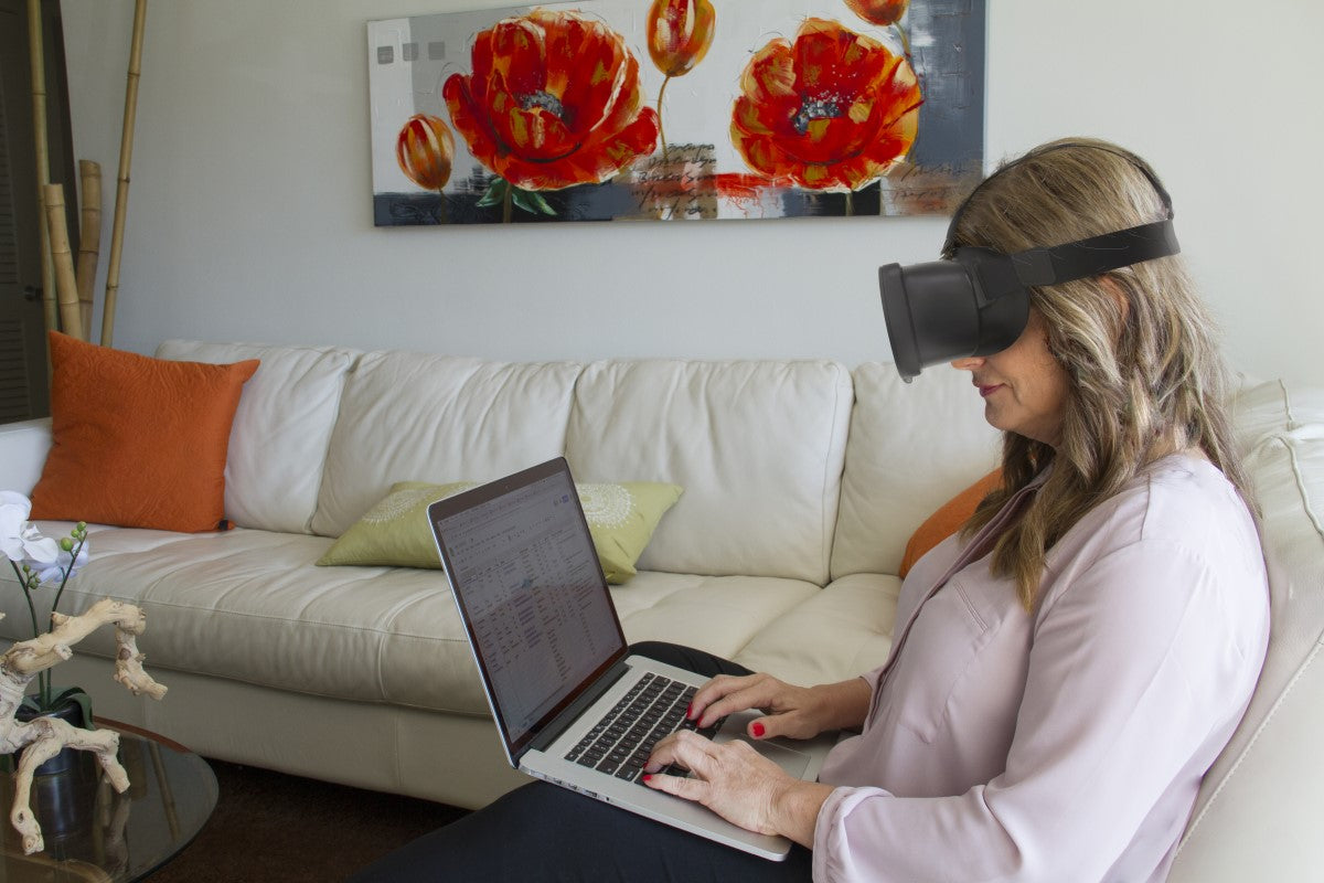 Image of person using Acesight VR smart glasses to read laptop