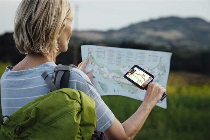 Image of a woman using the explore5 to read a map.
