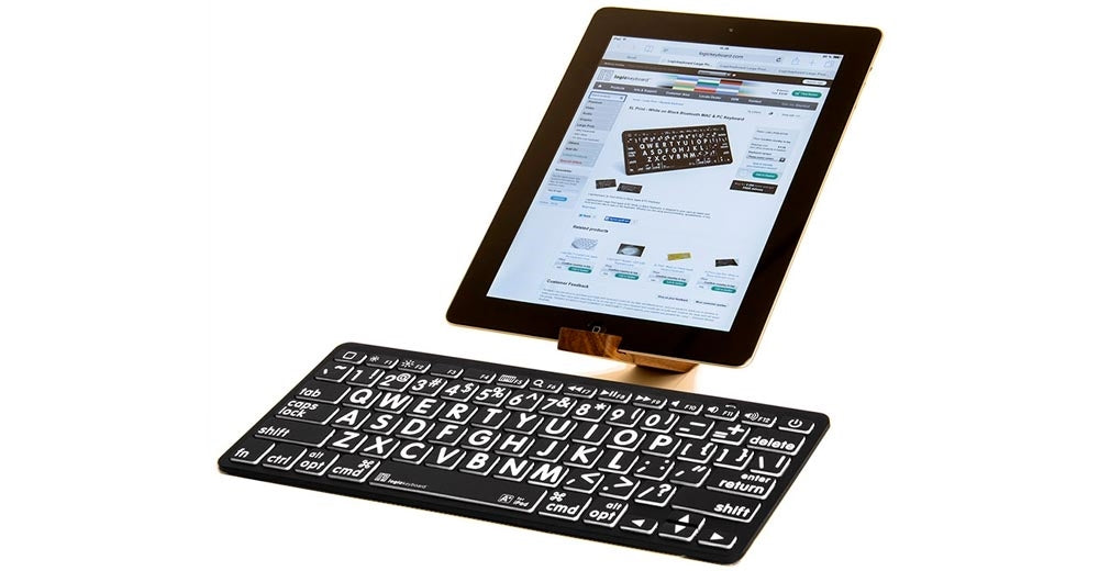 Image of the LargePrint Mini Bluetooth White on Black Keyboard for Mac from LogicKeyboard connected to a tablet.