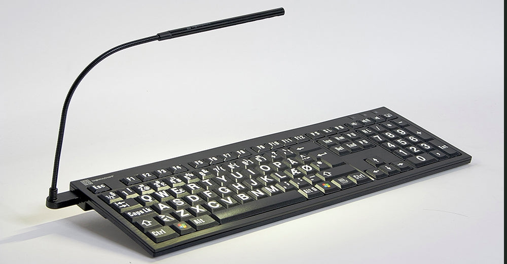 Image of the Nero LargePrint Slimline Yellow on Black Keyboard  for PC from LogicKeyboard with included book light.