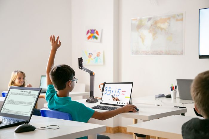 Image of a student using the Prodigi software with the Surface Pro 9 tablet, Solo 8+ camera, and bluetooth keyboard and mouse.