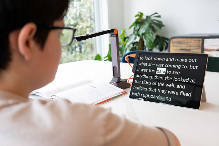 Image of a student completing their homework using the Surface Pro 9 tablet, Prodigi software, and the Solo 8+ camera.